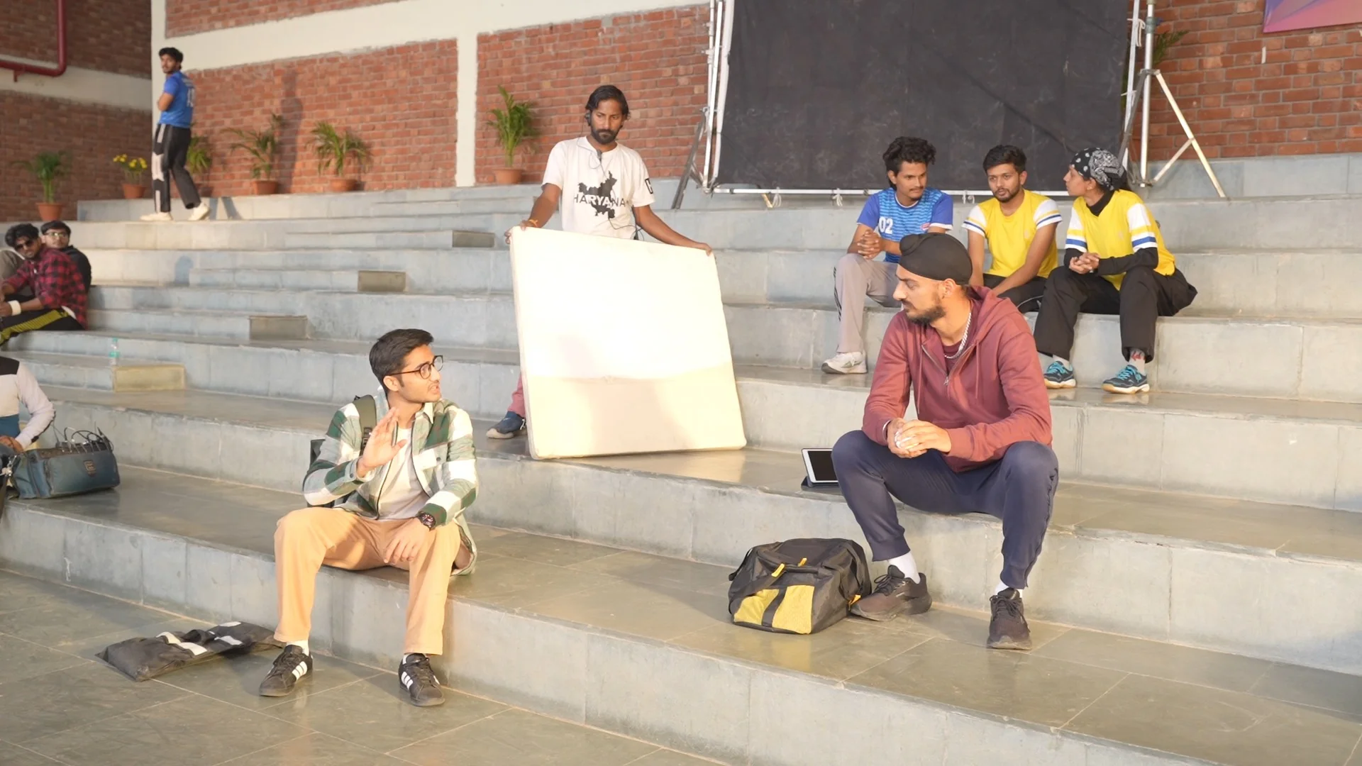 Cast and crew preparing a scene on the steps